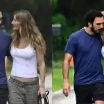 Gisele Bündchen e Joaquim Valente caminhando abraçados em jardim. Ela está vestindo uma regata branca e uma calça verde musgo. Joaquim veste uma camiseta em tom azul escuro e calça preta.