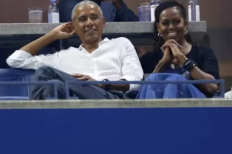 Barack Obama e Michelle Obama acompanhando jogo de tênis